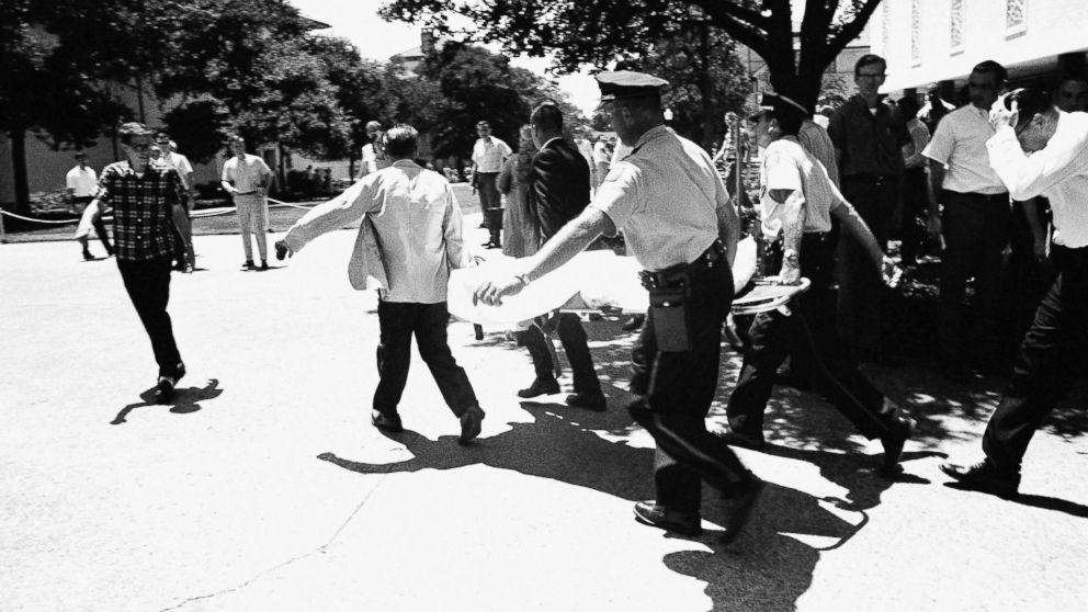 PHOTO: In this Aug. 1, 1966 file photo, one of the victims of Charles Joseph Whitman, the sniper who gunned down victims from a perch in the University of Texas tower, is carried across the campus to a waiting ambulance in Austin, Texas. 