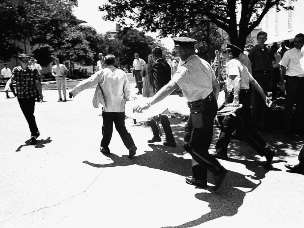 PHOTO: In this Aug. 1, 1966 file photo, one of the victims of Charles Joseph Whitman, the sniper who gunned down victims from a perch in the University of Texas tower, is carried across the campus to a waiting ambulance in Austin, Texas.