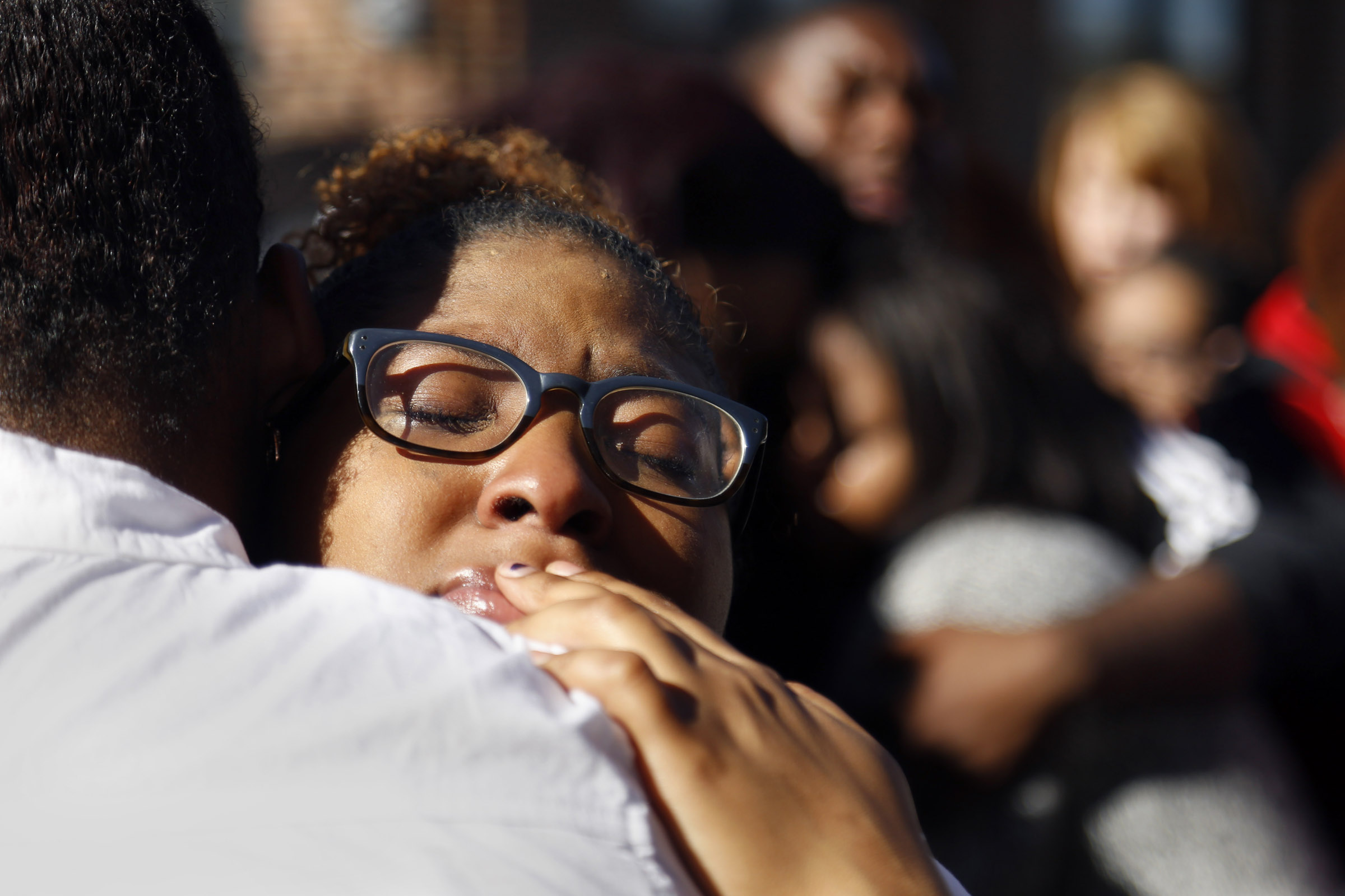 PHOTO: A member of Concerned Student 1950 hugs a fellow protestor after the group prayed together in front of the Reynolds Alumni Center on the University of Missouri campus in Columbia, Mo. on Nov. 7, 2015.
