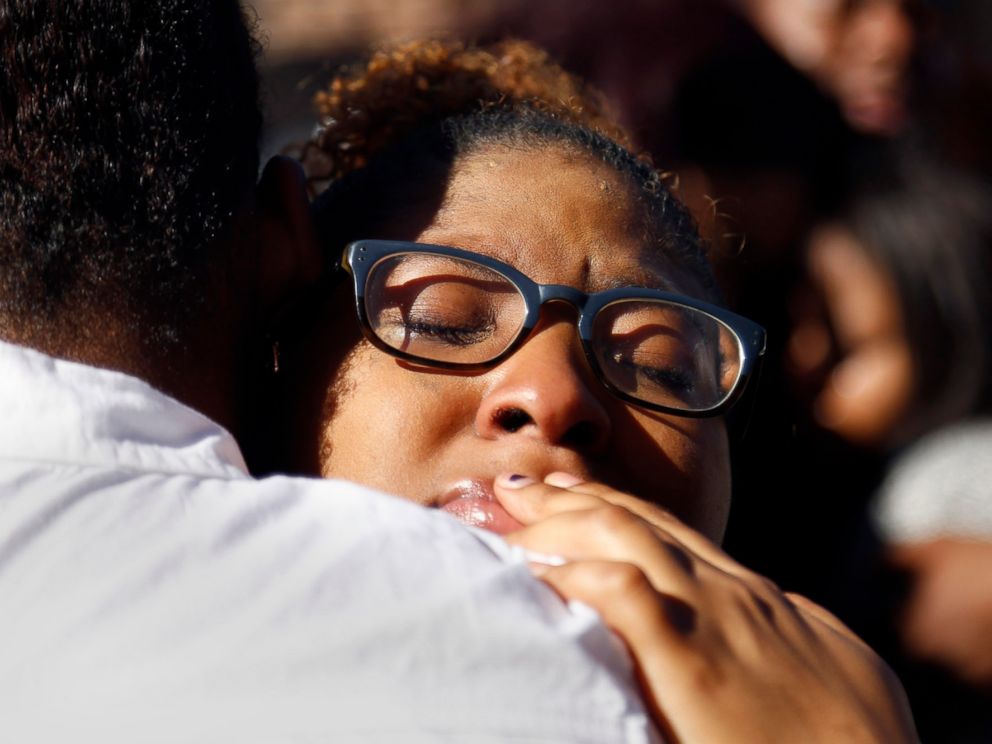 PHOTO: A member of Concerned Student 1950 hugs a fellow protestor after the group prayed together in front of the Reynolds Alumni Center on the University of Missouri campus in Columbia, Mo. on Nov. 7, 2015.