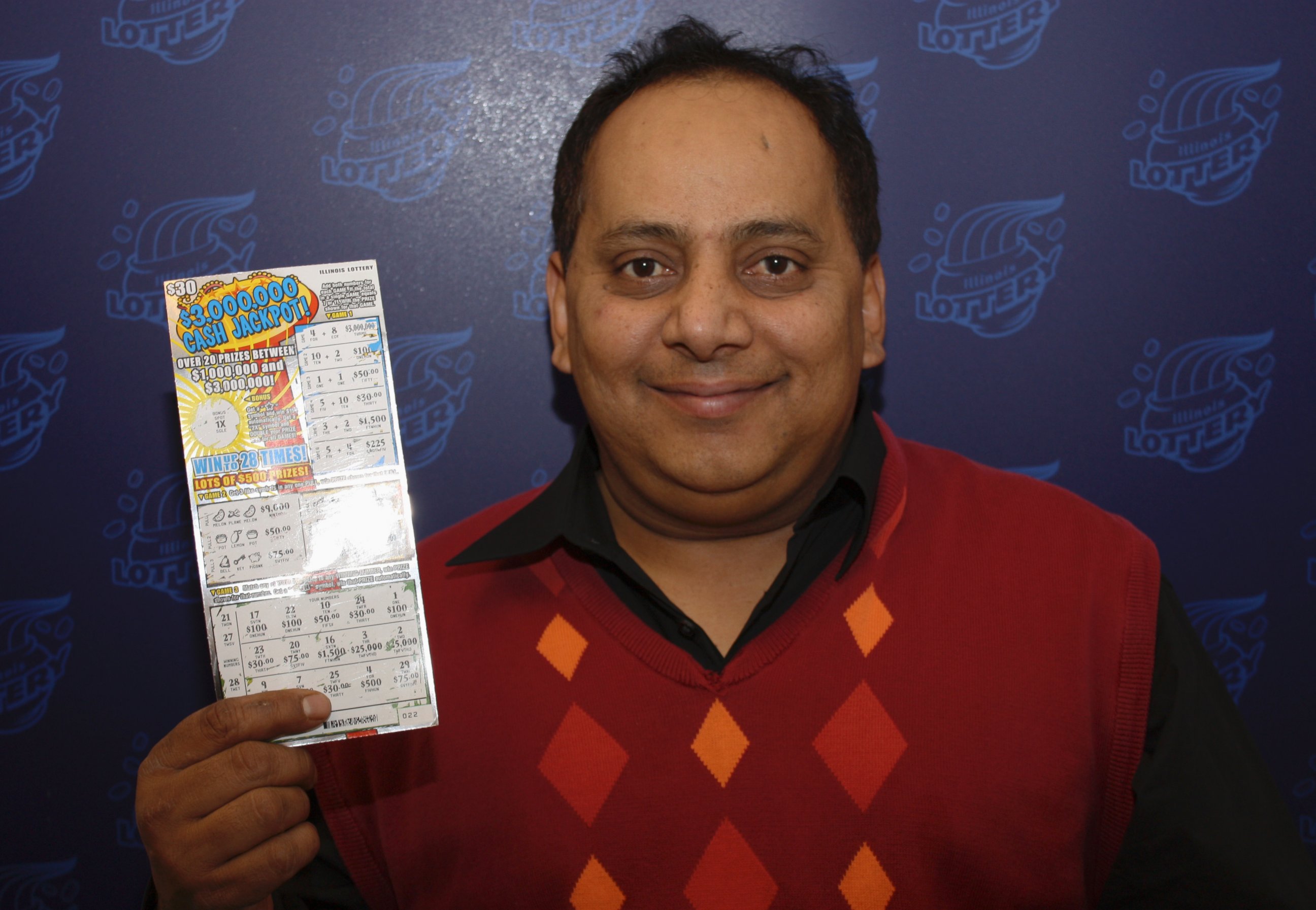 PHOTO: This undated photo provided by the Illinois Lottery shows Urooj Khan, 46, of Chicago's West Rogers Park neighborhood, posing with a winning lottery ticket. 