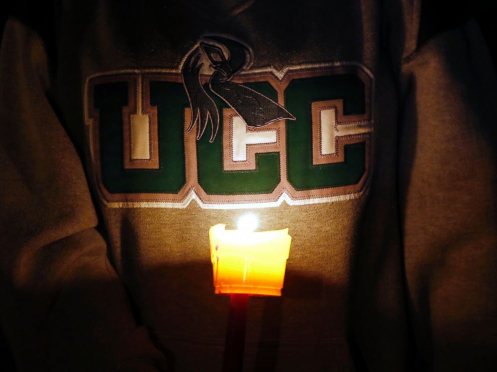 PHOTO: Diana Nicolay, a former employee of Umpqua Community College, wears a school sweatshirt during a candle light vigil for those killed during a fatal shooting at the school, Oct. 1, 2015.