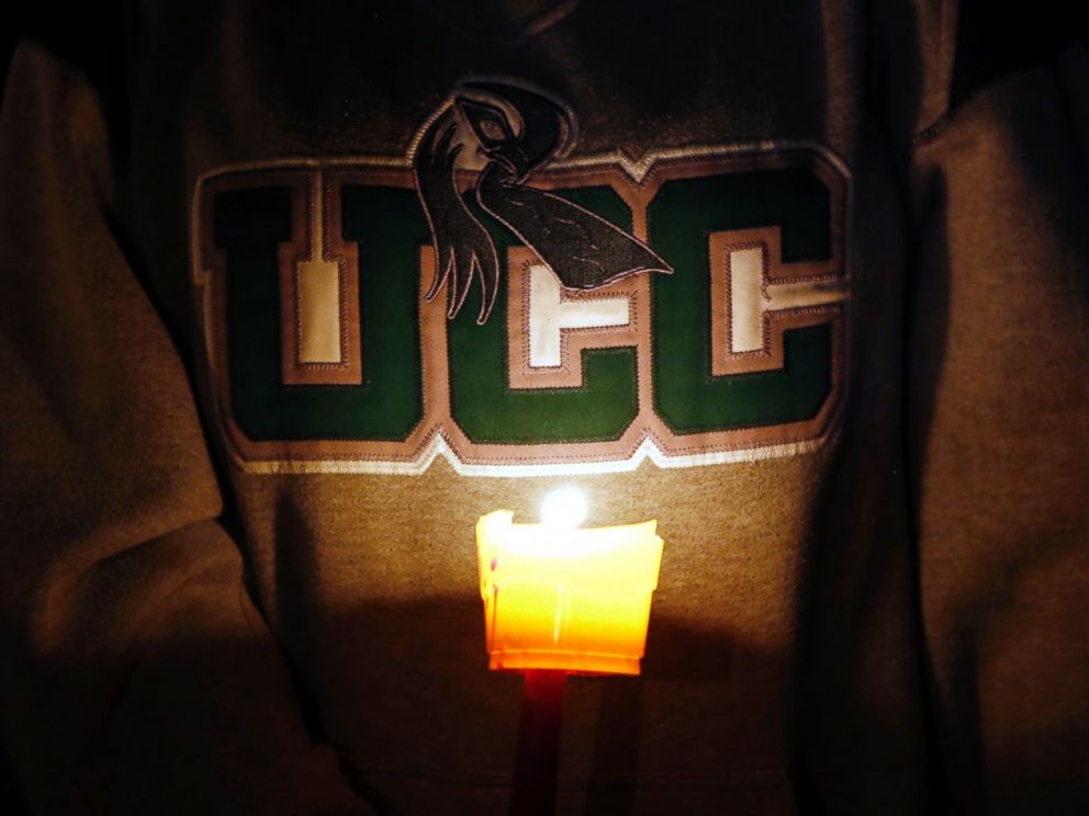 PHOTO: Diana Nicolay, a former employee of Umpqua Community College, wears a school sweatshirt during a candle light vigil for those killed during a fatal shooting at the school, Oct. 1, 2015.