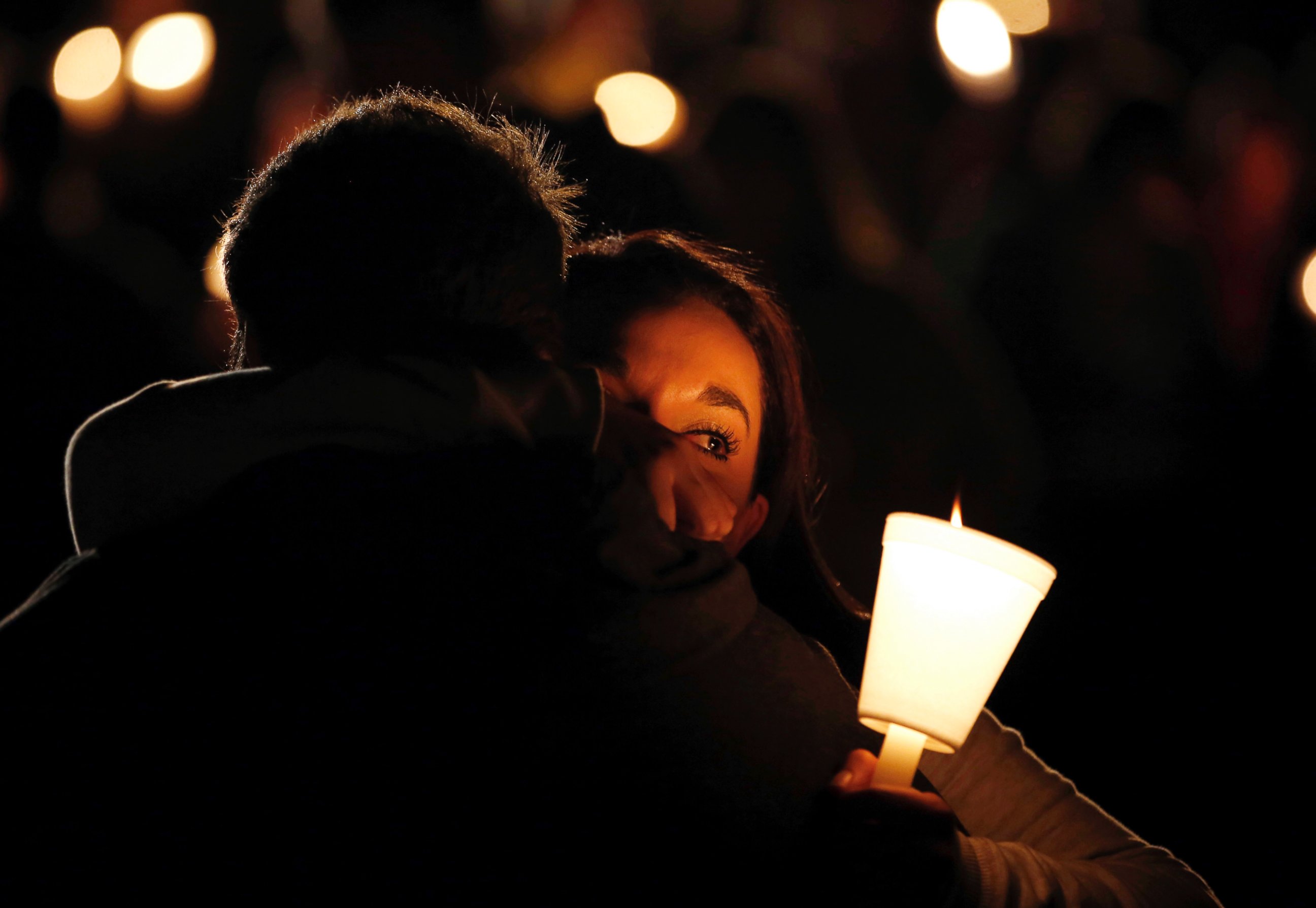 PHOTO: Umpqua Community College student Nichole Zamarripa, right, is consoled during a candle light vigil for those killed during a fatal shooting at the school, Oct. 1, 2015, in Roseburg, Ore.