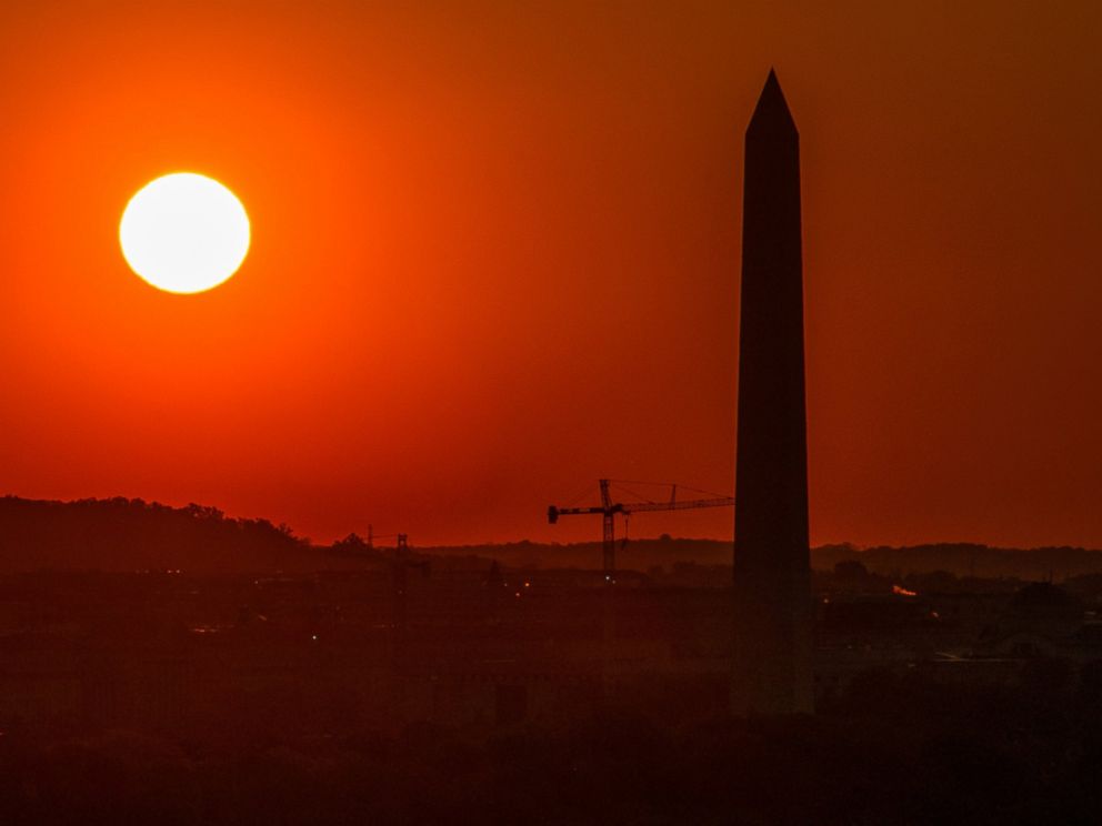 PHOTO: Sunrise behind the Washington Monument is seen from Arlington House in Arlington National Cemetery in Arlington, Va. May 4, 2014.
