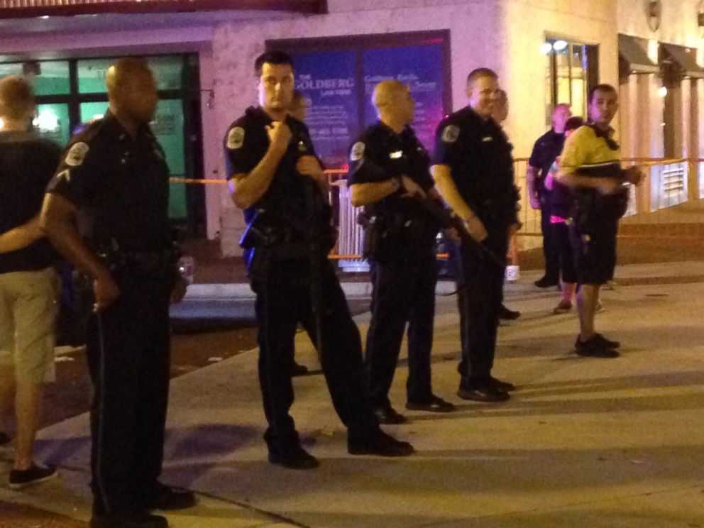 PHOTO: Police stand during the early morning, Oct. 18, 2015, near the site of a shooting at ZombiCon in Fort Myers Fla.