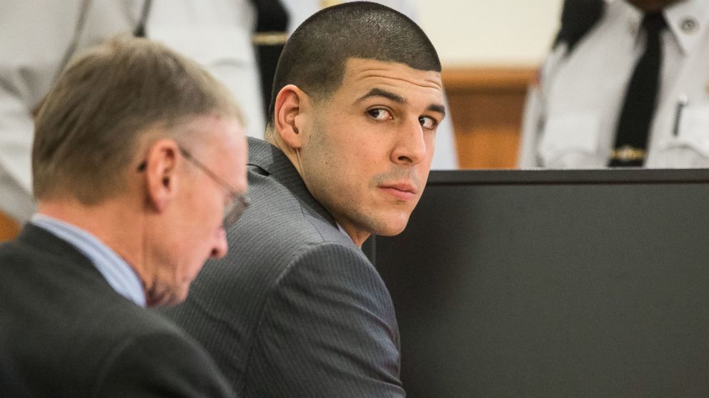Former New England Patriots player Aaron Hernandez glances towards the Lloyd family during his trial at Bristol County Superior Court in Fall River, Ma., Feb. 3, 2015. 
