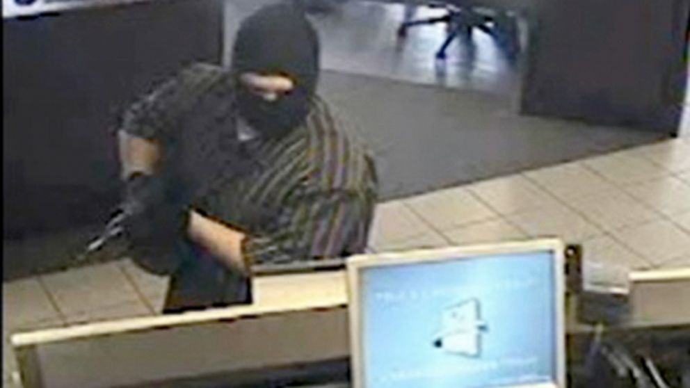 This surveillance image provided by the King County Sheriff's Office shows a man armed with an assault rifle robbing a Chase bank in North Bend, Wash., on July 6, 2012. 