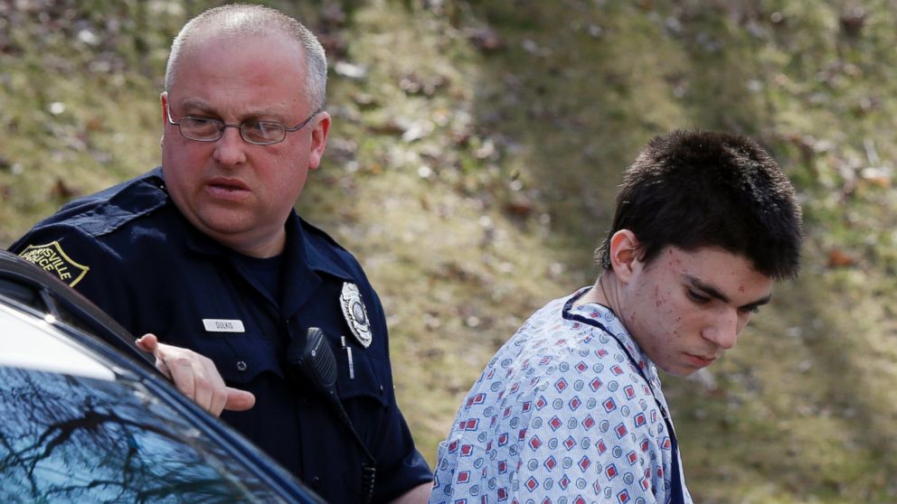 Alex Hribal, the suspect in the multiple stabbings at the Franklin Regional High School in Murrysville, Pa., is escorted by police to a district magistrate to be arraigned, April 9, 2014, in Export, Pa.