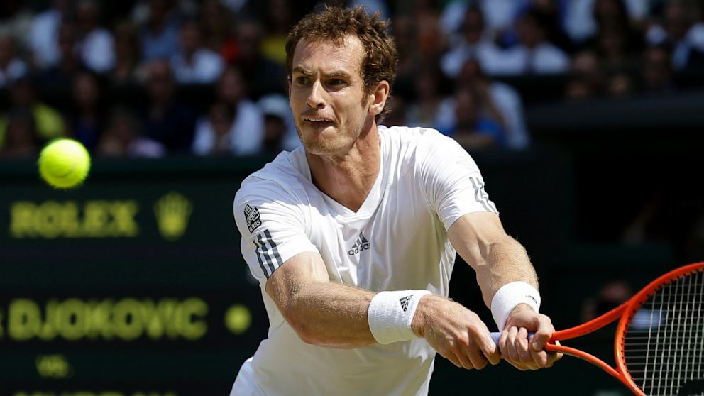 Andy Murray of Britain returns to Novak Djokovic of Serbia during the Men's singles final match at the All England Lawn Tennis Championships in Wimbledon, London, Sunday, July 7, 2013. 