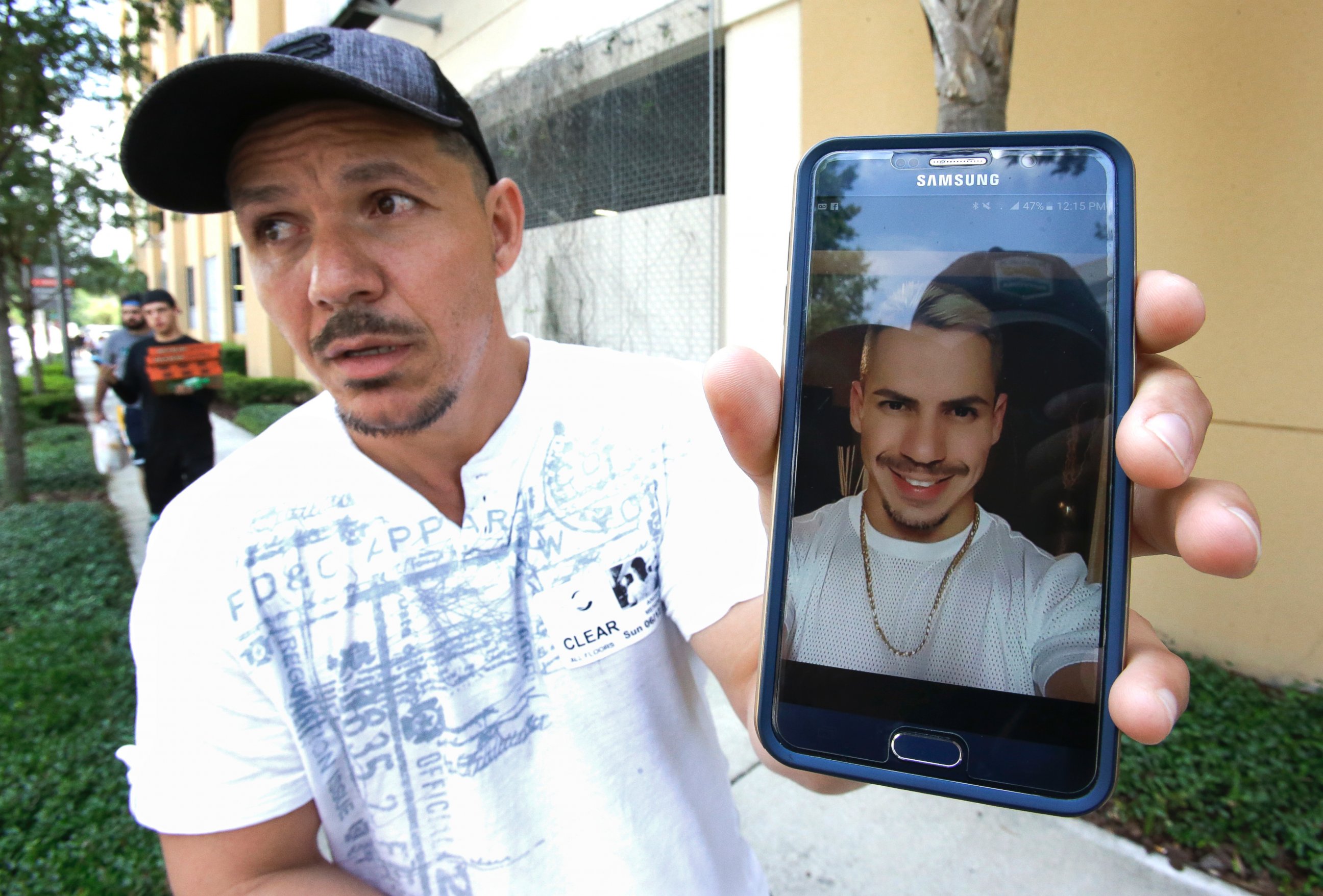 PHOTO: Angel Mendez holds up a cell phone photo trying to get information about his brother Jean C. Mendez that was at the Pulse Nightclub where a shooting involving multiple fatalities occurred, June 12, 2016, in Orlando, Fla. 