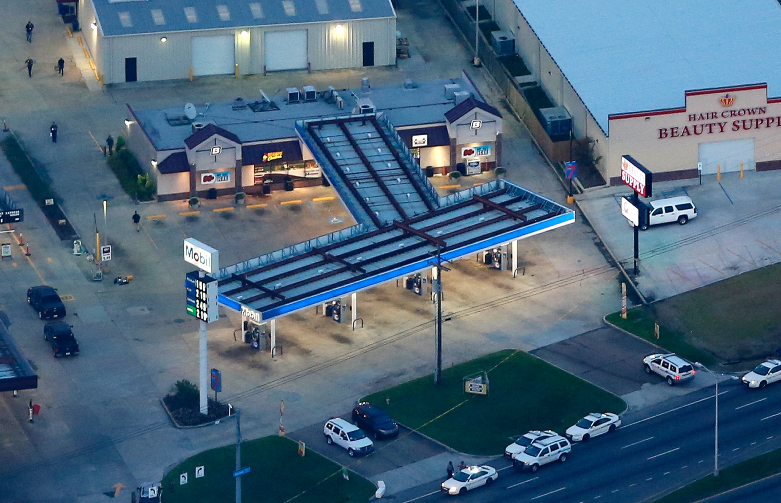 PHOTO: In this aerial photo, investigators work the shooting scene in Baton Rouge, Louisiana, where several law enforcement officers were either shot or killed, July 17, 2016. 