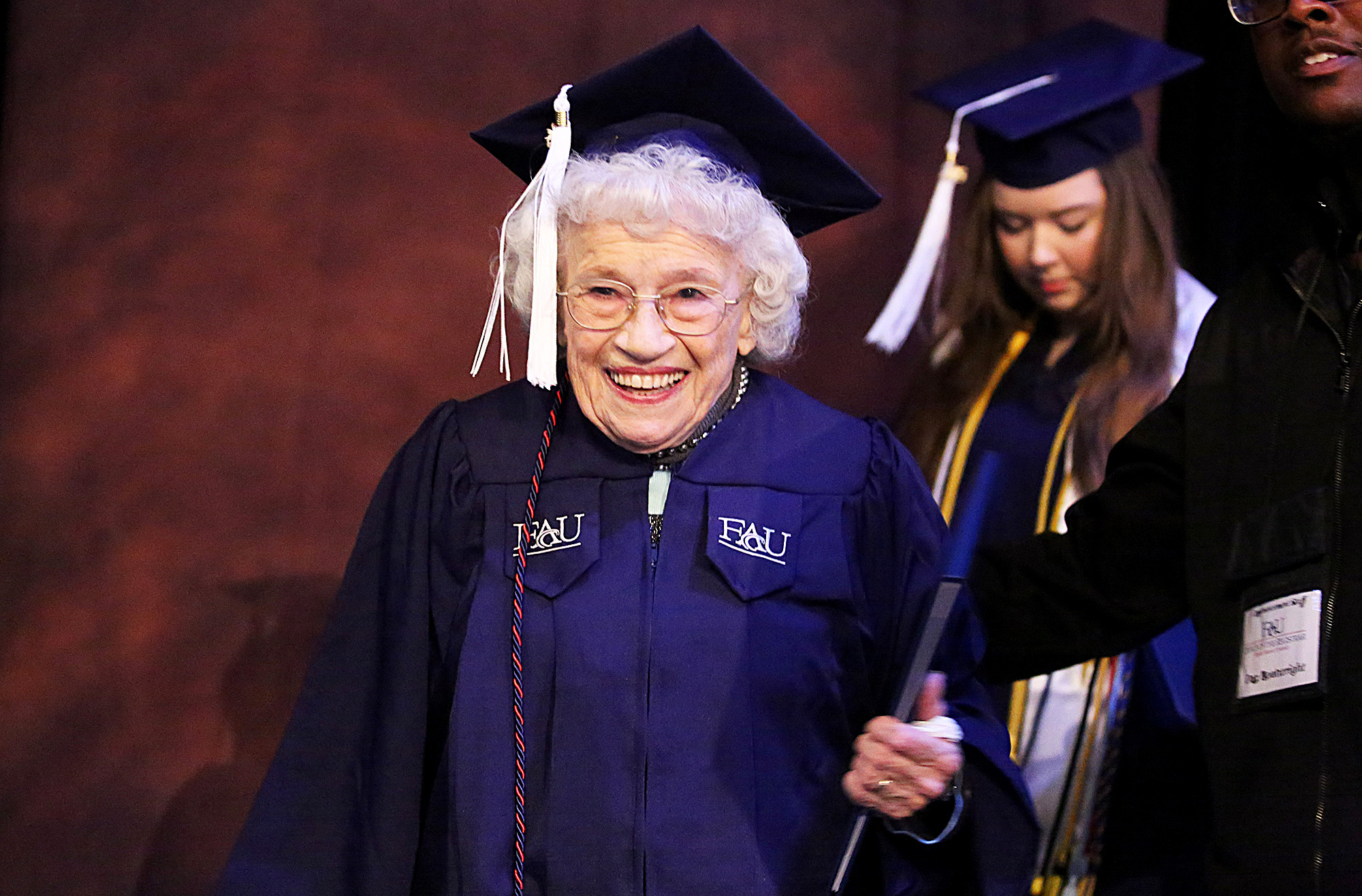 PHOTO: Betty Reilly walks across the stage at Florida Atlantic University to receive a Bachelor of Arts degree in English, Dec. 10, 2015 in Boca Raton, Fla. 