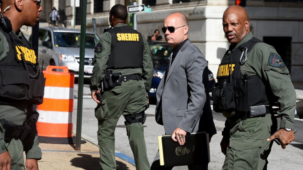 Baltimore Police Lt. Brian Rice, center, arrives at Courthouse East, July 5, 2016 in Baltimore for a pretrial hearing related to the arrest and death of Freddie Gray.