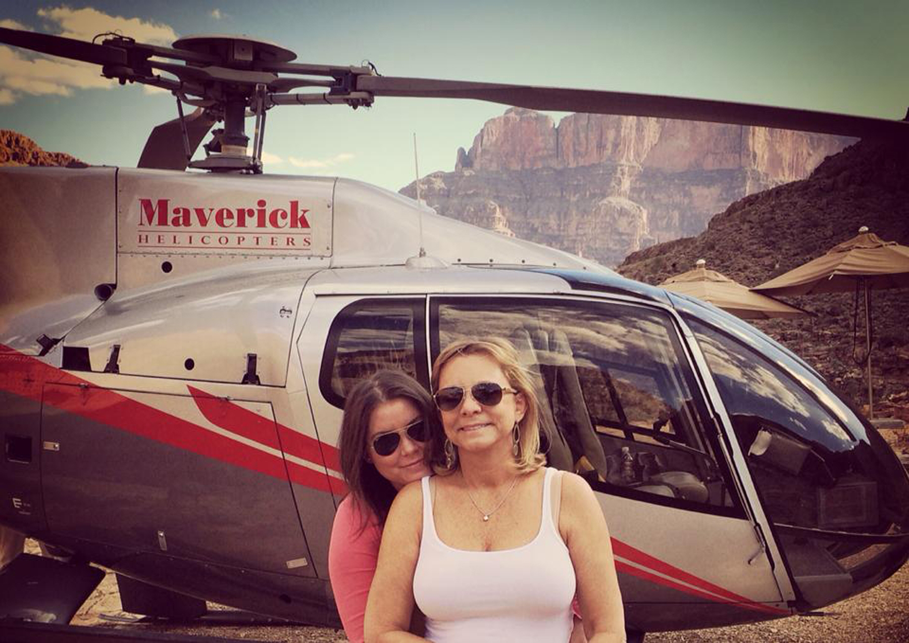 PHOTO: Brittany Maynard, left, hugs her mother, Debbie Ziegler, next to a helicopter at the Grand Canyon National Park in Arizona, Oct. 21, 2014. 