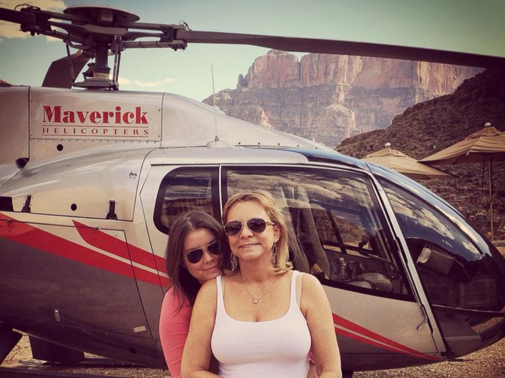 PHOTO: Brittany Maynard, left, hugs her mother, Debbie Ziegler, next to a helicopter at the Grand Canyon National Park in Arizona, Oct. 21, 2014.