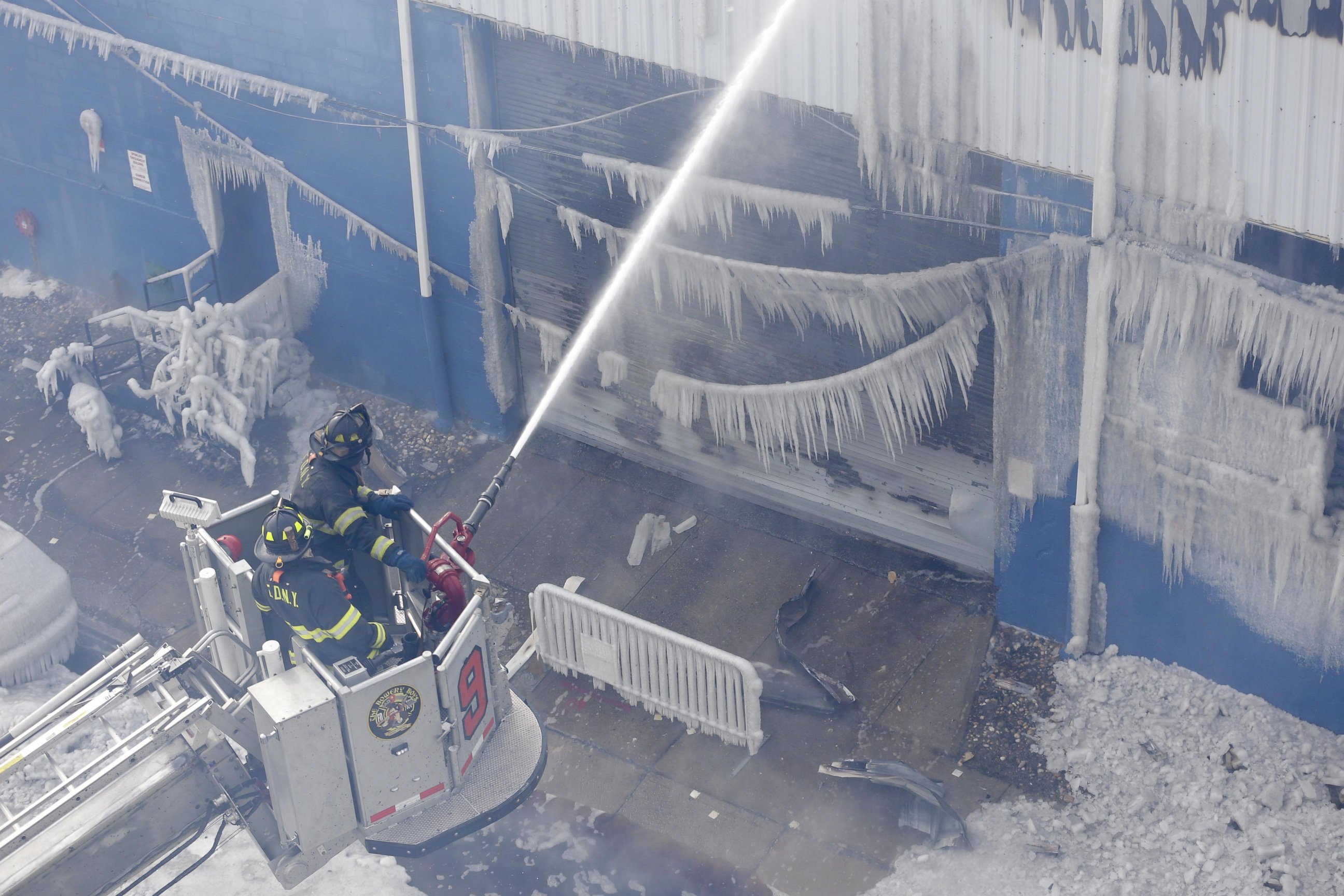PHOTO: Firefighters work to keep down a fire at a warehouse in the Brooklyn borough of New York, Sunday, Feb. 1, 2015. 