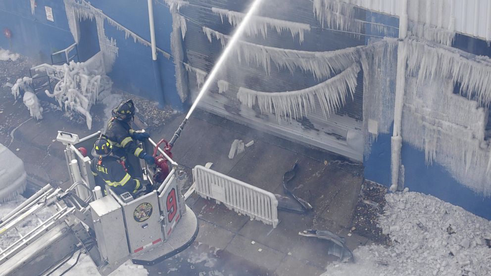 PHOTO: Firefighters work to keep down a fire at a warehouse in the Brooklyn borough of New York, Sunday, Feb. 1, 2015. 