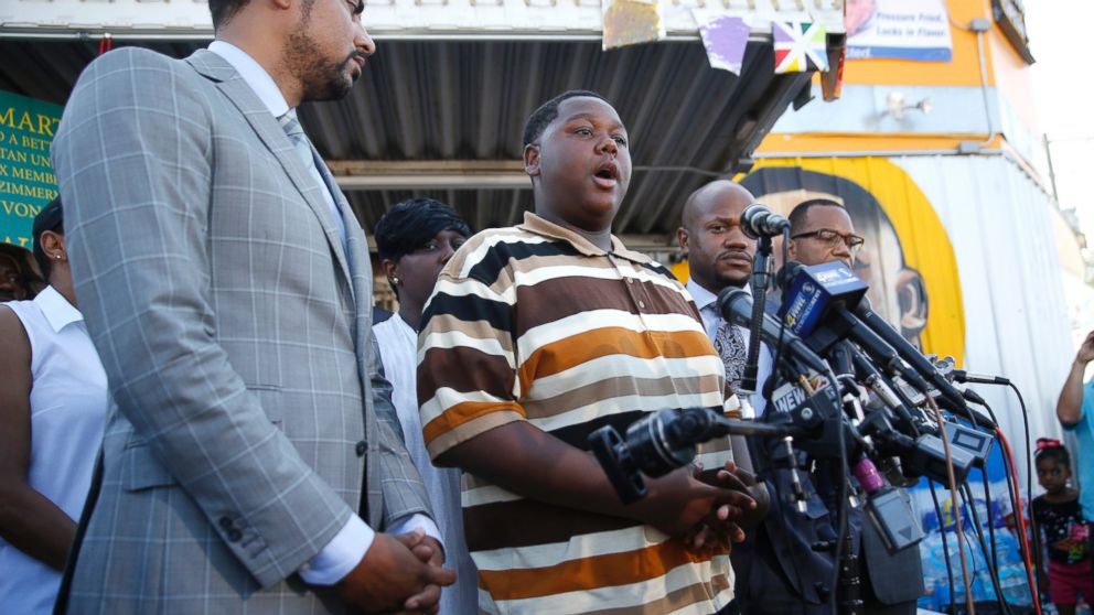 Cameron Sterling, center, son of Alton Sterling, who was killed by Baton Rouge police, speaks to the media outside the Triple S Food Mart, in Baton Rouge, La., July 13, 2016.