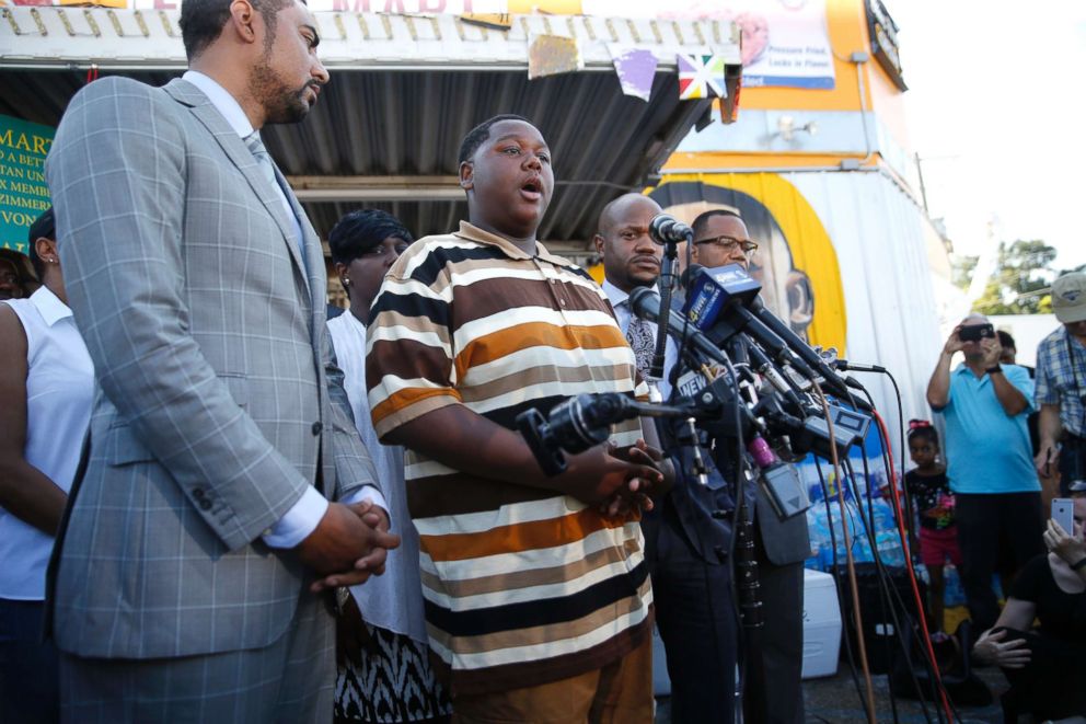 PHOTO: Cameron Sterling, center, son of Alton Sterling, who was killed by Baton Rouge police, speaks to the media outside the Triple S Food Mart, in Baton Rouge, La., July 13, 2016.