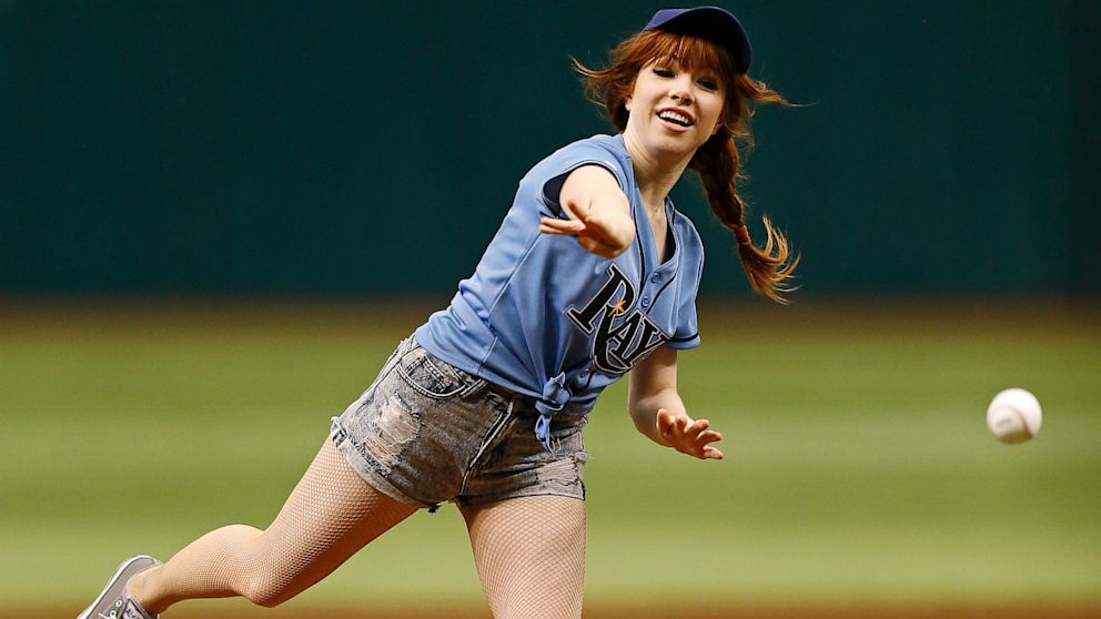 Carly Rae Jepsen throws out the first pitch prior to a baseball game between the Houston Astros and Tampa Bay Rays, July 14, 2013, in St. Petersburg, Fla.