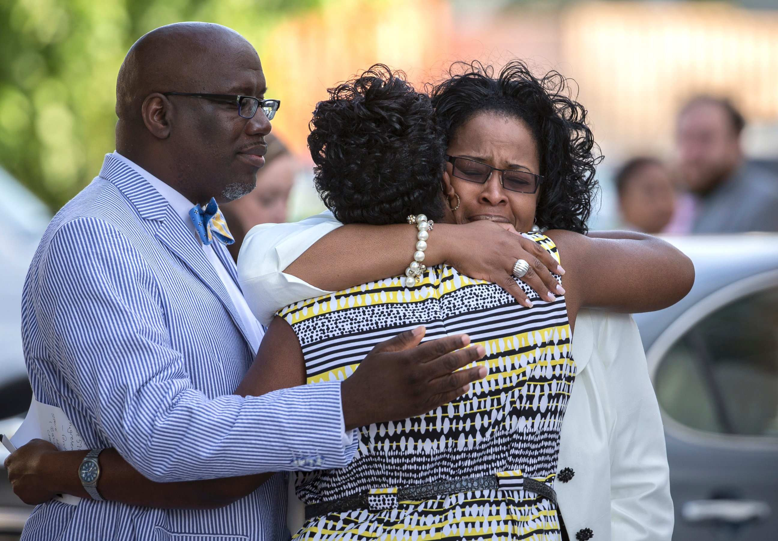 PHOTO: A group of church members greet each other before entering the Emanuel AME Church for a worship service, June 21, 2015, in Charleston, S.C.