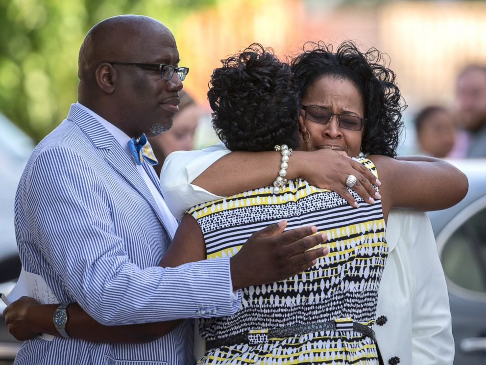 PHOTO: A group of church members greet each other before entering the Emanuel AME Church for a worship service, June 21, 2015, in Charleston, S.C.