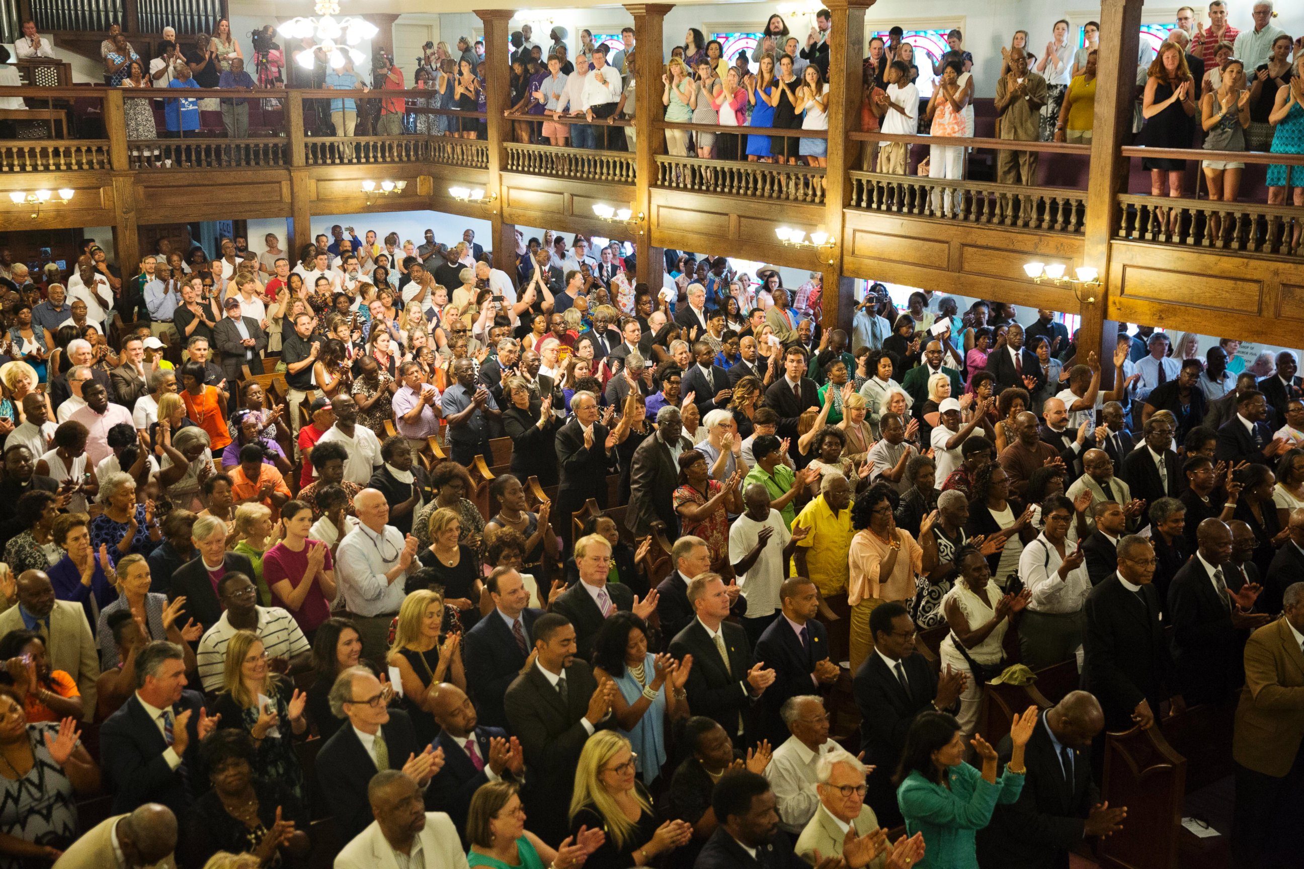 PHOTO: Parishioners applaud during a memorial service at Morris Brown AME Church for the people killed Wednesday during a prayer meeting inside a historic black church in Charleston, S.C., June 18, 2015.