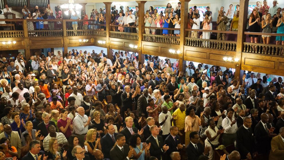 Parishioners applaud during a memorial service at Morris Brown AME Church for the people killed Wednesday during a prayer meeting inside a historic black church in Charleston, S.C., June 18, 2015. 