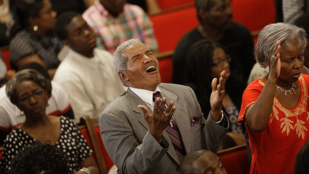 Parishioners sing at the Emanuel A.M.E. Church four days after a mass shooting that claimed the lives of it's pastor and eight others, June 21, 2015, in Charleston, S.C.