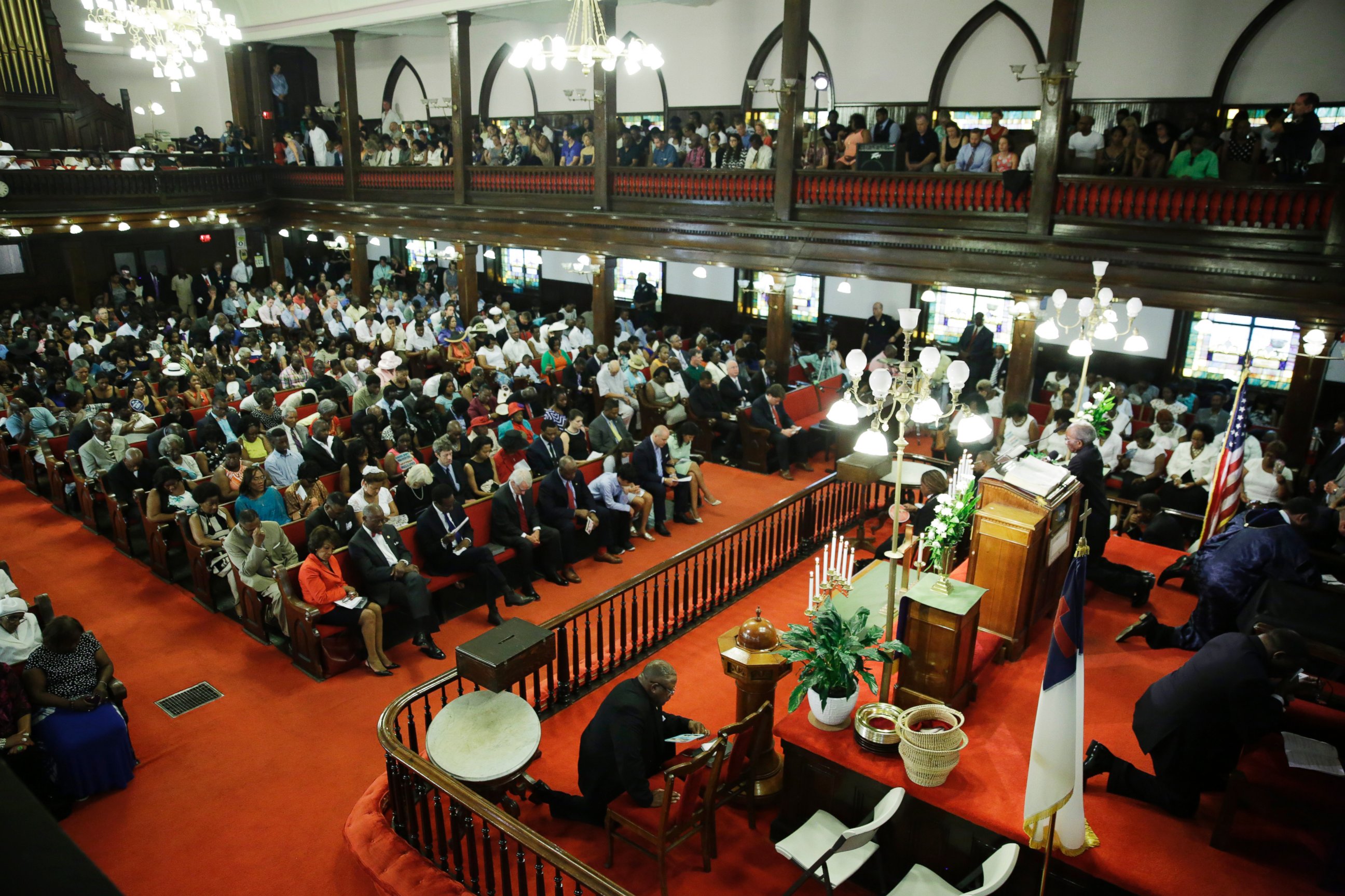 PHOTO: Parishioners prays at the Emanuel A.M.E. Church four days after a mass shooting that claimed the lives of it's pastor and eight others, June 21, 2015, in Charleston, S.C.