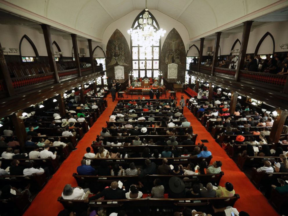 PHOTO: Parishioners sit at the Emanuel A.M.E. Church four days after a mass shooting that claimed the lives of its pastor and eight others, June 21, 2015, in Charleston, S.C.