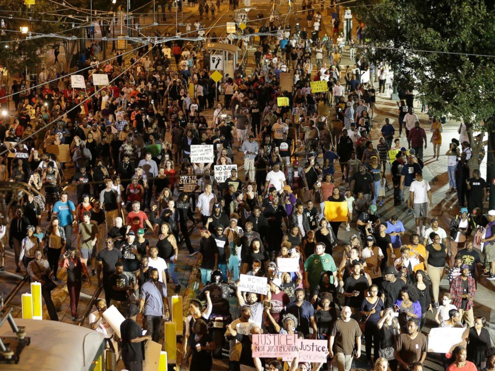 PHOTO: Demonstrators protest Tuesdays fatal police shooting of Keith Lamont Scott in Charlotte, North Carolina on Sept. 21, 2016. Protesters rushed police in riot gear at a downtown Charlotte hotel and officers have fired tear gas to disperse the crowd.