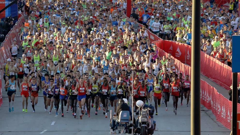 Runners start the Chicago Marathon in Chicago, Sunday, Oct. 13, 2013, nearly six months after the Boston Marathon bombings, with more police officers lining race routes and spectator areas. 