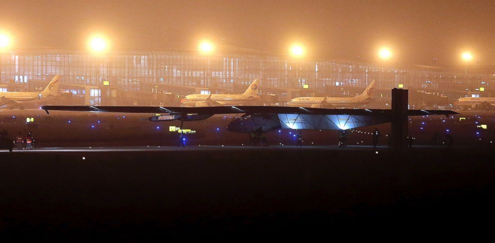 PHOTO: Ground crew move out the Solar Impulse 2 for takeoff at Nanjing Lukou International Airport in Nanjing in eastern China's Jiangsu province, Sunday, May 31, 2015. 