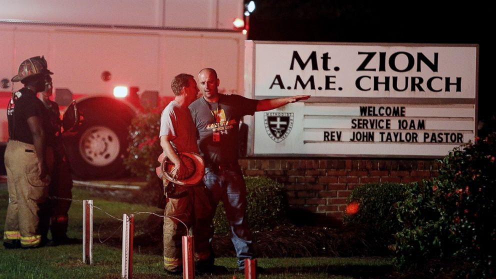 PHOTO: Public safety personnel talk outside Mount Zion African Methodist Episcopal church, June 30, 2015, in Greeleyville, S.C. 