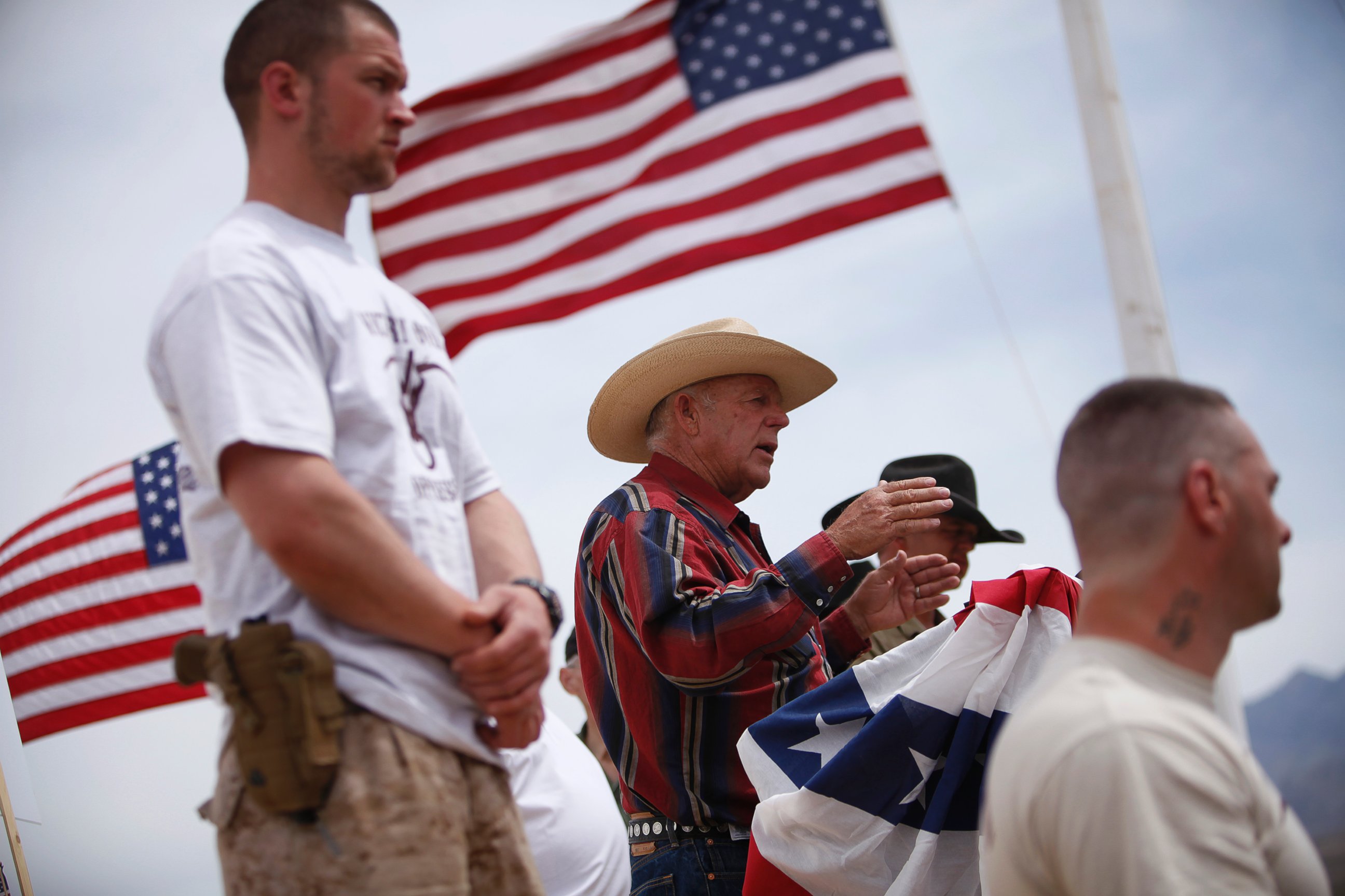 PHOTO: Flanked by armed supporters, rancher Cliven Bundy speaks at a protest camp near Bunkerville, Nev. Friday, April 18, 2014.