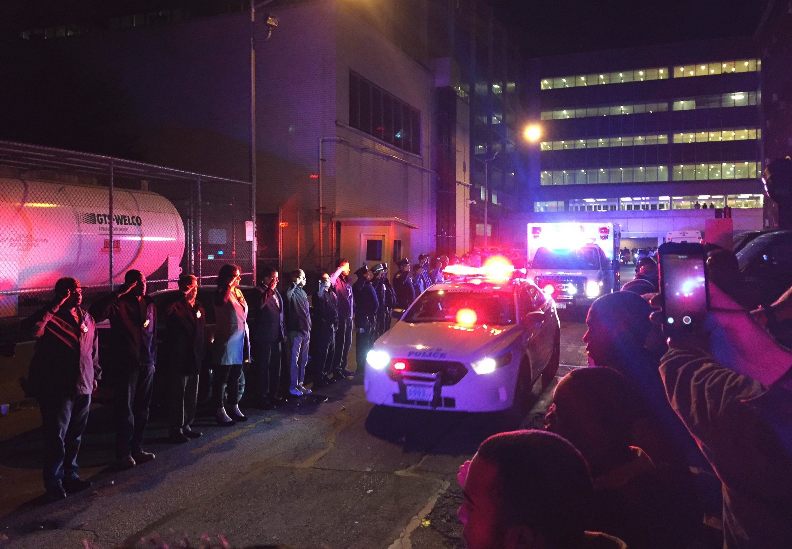 PHOTO:Police salute outside Harlem Hospital Center as the body of New York Police Department Officer Randolph Holder passes by in an ambulance, Oct. 21, 2015, in New York. 