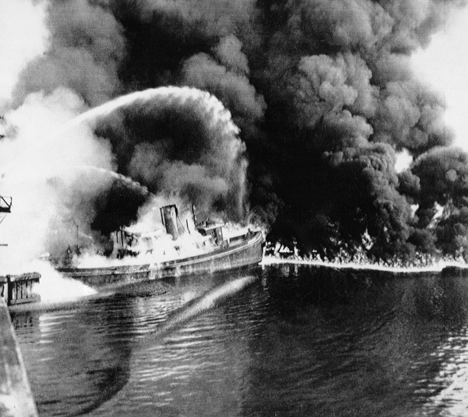 PHOTO: A fire tug fights flames on the Cuyahoga River near downtown Cleveland, where oil and other industrial wastes caught fire June 25, 1952. 