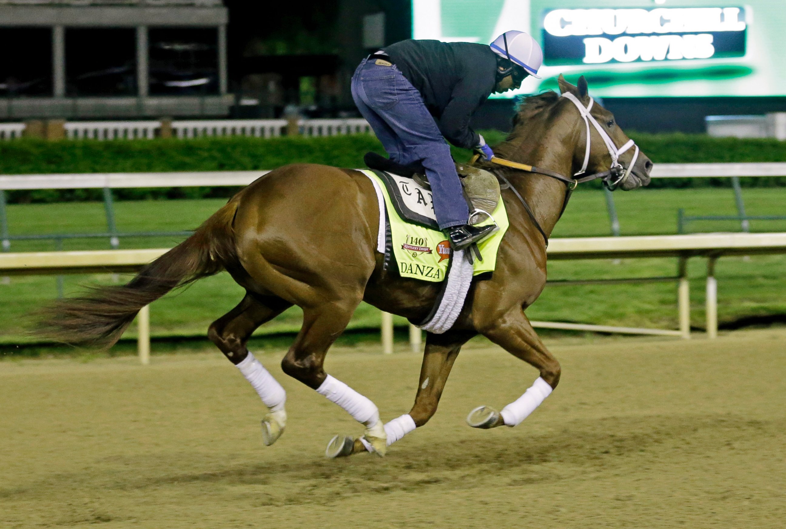 PHOTO: Exercise rider Ezequiel Perez takes Kentucky Derby entrant Danza for a morning workout during a morning workout at Churchill Downs, May 2, 2014, in Louisville, Ky.