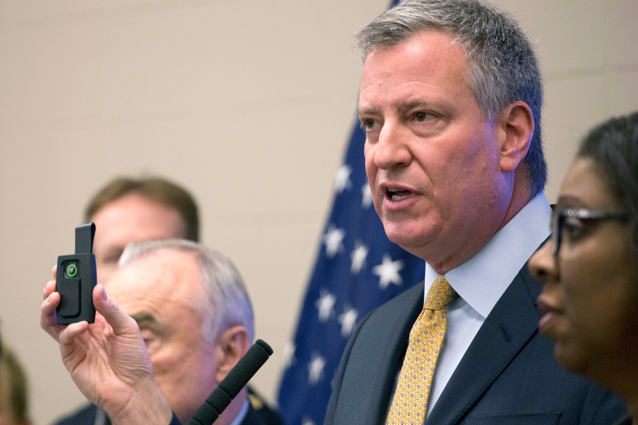 PHOTO: New York Mayor Bill de Blasio holds a body camera during a news conference to discuss a pilot program for the use of body cameras for some police officers, at the Police Academy in Queens, Dec. 3, 2014.