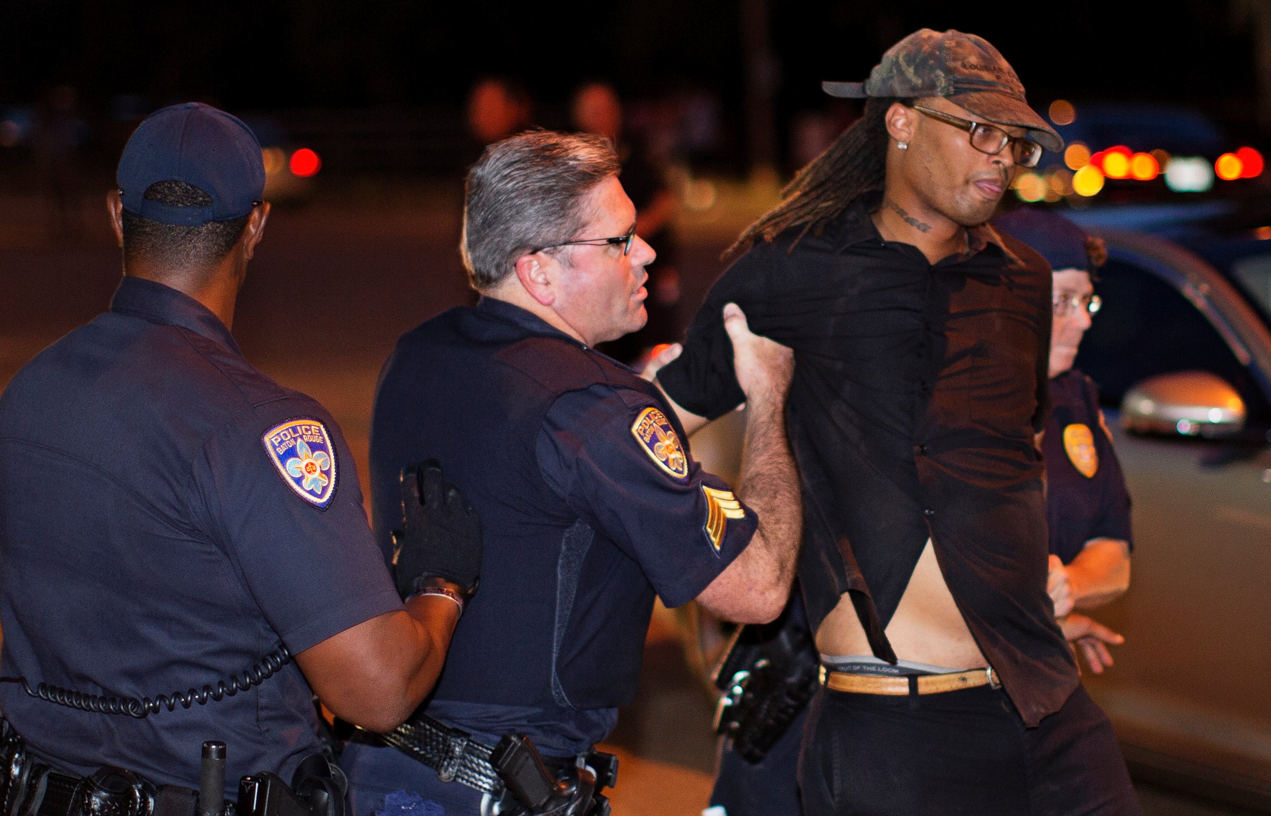 PHOTO: Police arrest a man for blocking a road in near the Baton Rouge Police Department headquarters Saturday, July 9, 2016.