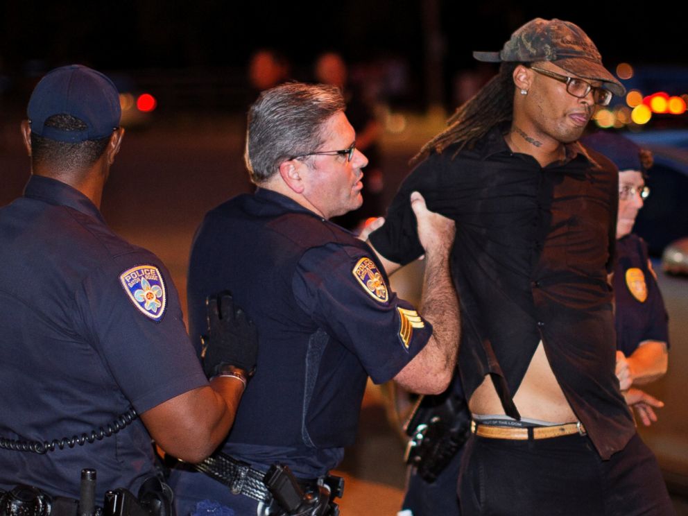 PHOTO: Police arrest a man for blocking a road in near the Baton Rouge Police Department headquarters Saturday, July 9, 2016.
