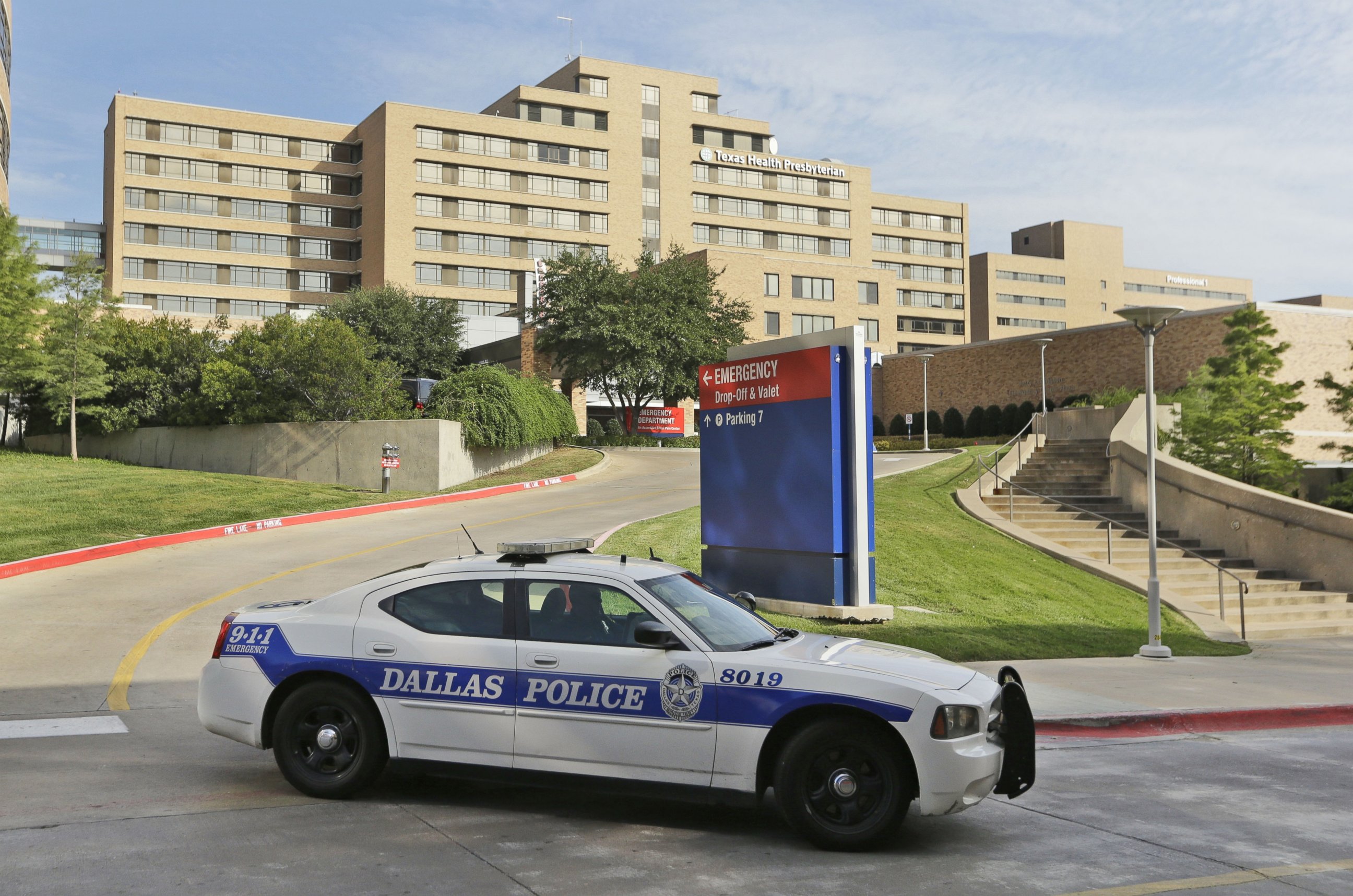 PHOTO: A police car drives past the entrance to the Texas Health Presbyterian Hospital in Dallas
