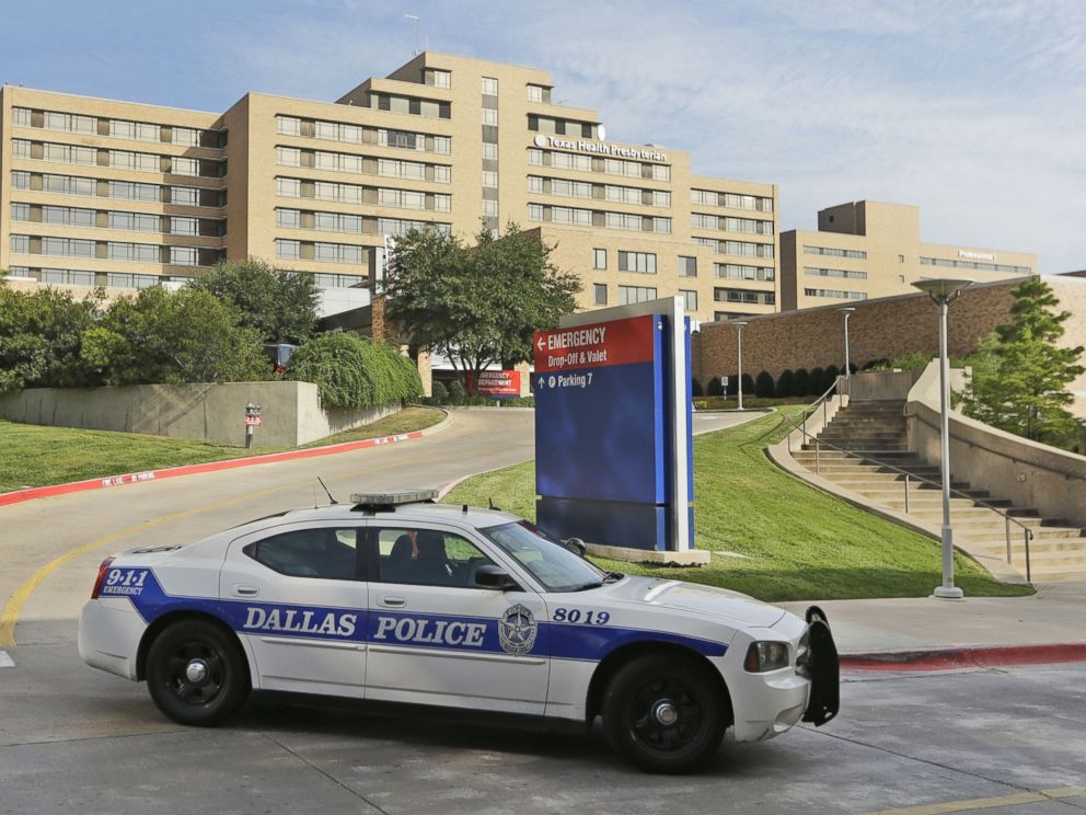 PHOTO: A police car drives past the entrance to the Texas Health Presbyterian Hospital in Dallas