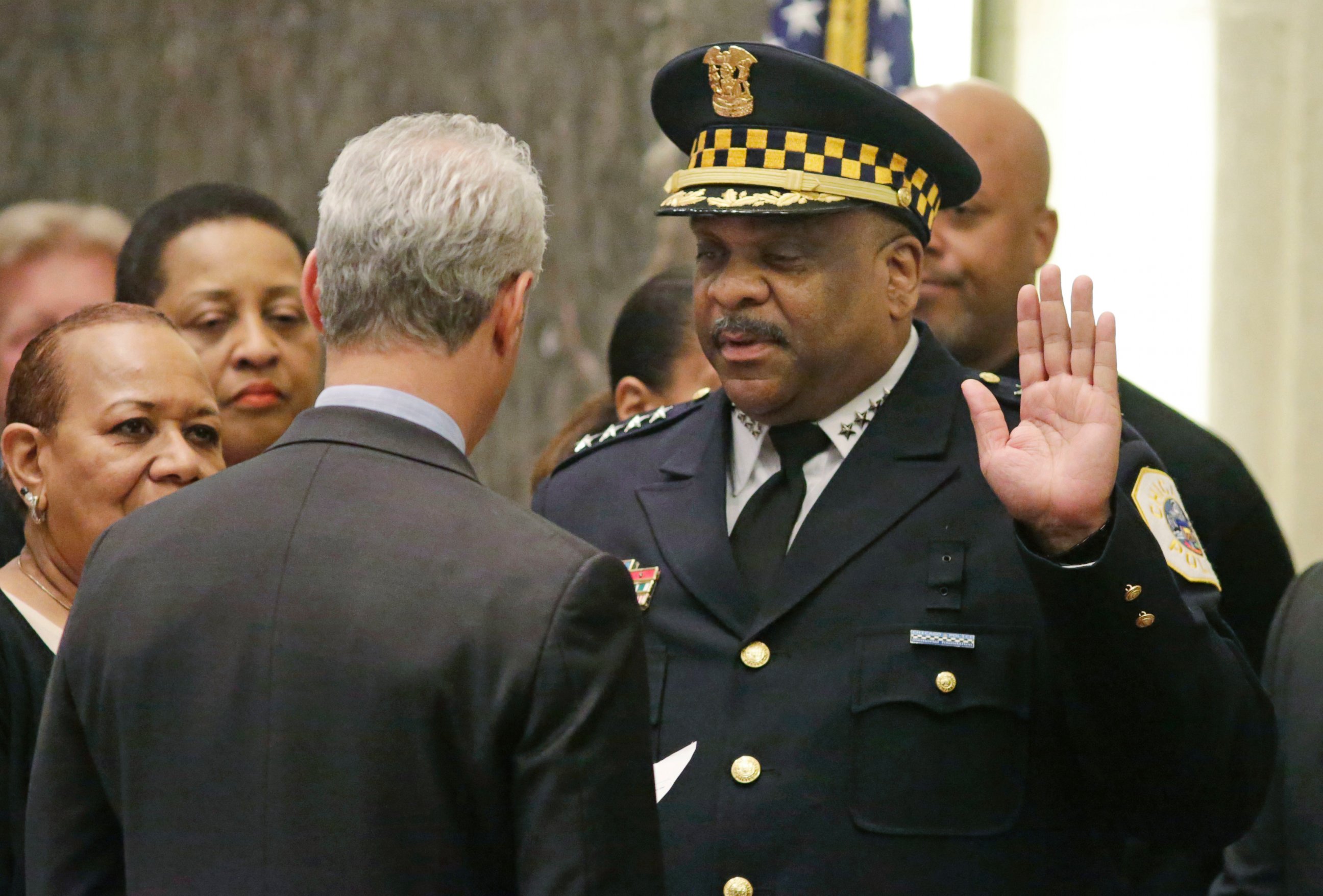 Chicago Mayor Rahm Emanuel swears in Eddie Johnson as the new Chicago police superintendent at a city council meeting, April 13, 2016, in Chicago.
