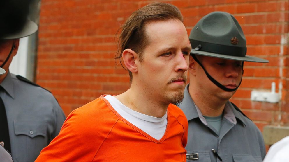 PHOTO: Eric Frein is escorted by police out the Pike County Courthouse after his arraignment in Milford, Pa., Oct. 31, 2014.