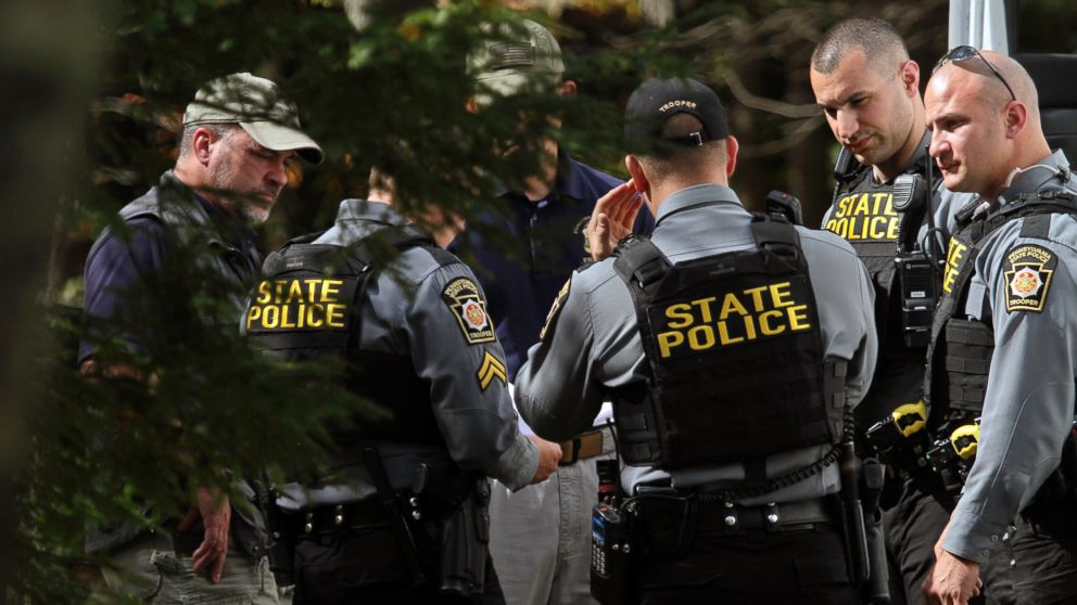 PHOTO: Pennsylvania State Police conferred along Snow Hill Road in Price Township, Pennsylvania, Sept. 30, 2014, as the search for suspected killer Eric Frein carried on for the 18th day.