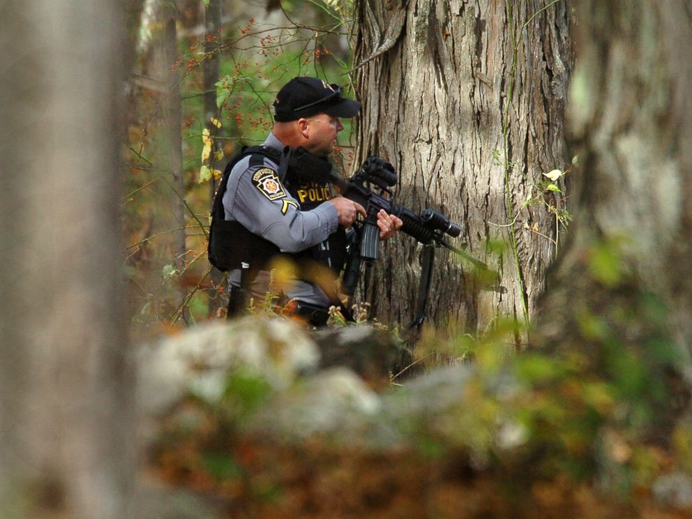 PHOTO: A Pennsylvania State Trooper searches the woods near Lower Swiftwater Road in Swiftwater, Pa., Oct. 18, 2014 during a massive manhunt for killer Eric Frein.