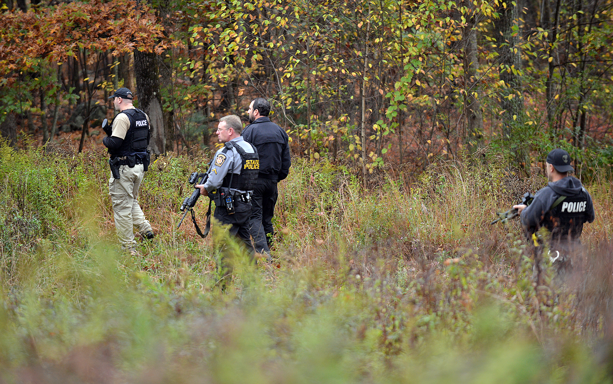 PHOTO: Police search an area in Price Townhsip Pa., near Alpine Ski Resort, Oct. 11, 2014, as they look for Eric Frein, the suspect in last month's deadly ambush at a state police barracks. 